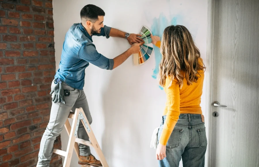 Expert-Residential-Painting-Services women-and-men-paint-wall